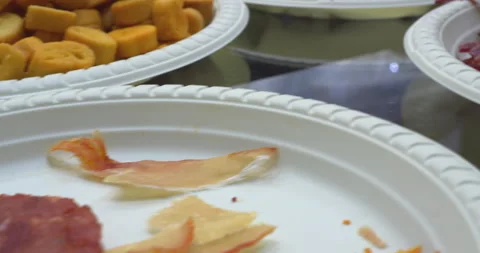 Variety of dried snacks displayed on tasting plates Stock Footage 302344462