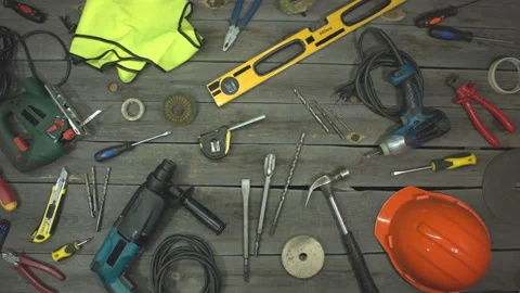 A variety of electro and hand tools and special clothing. Top view. Видео 121872034