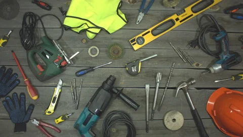 A variety of electro and hand tools and special clothing. Top view. Видео 121872085