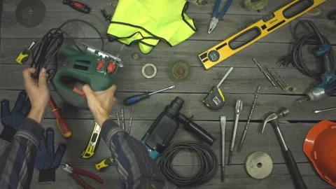 A variety of electro and hand tools and special clothing. Top view. Slow motion. Stock Footage 121872190