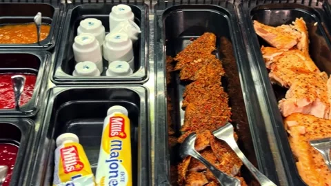 Variety of Fish, Cheese, Eggs, and Vegetables on Buffet Table in Norway Stock-Footage 340254842
