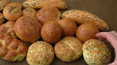 Variety of fresh bread on sacking Stock Footage 60701475