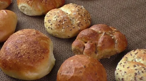 Variety of fresh bread on sacking Stock Footage 60701485