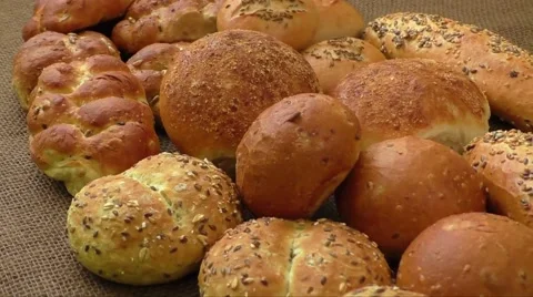 Variety of fresh bread on sacking Stock Footage 61366450