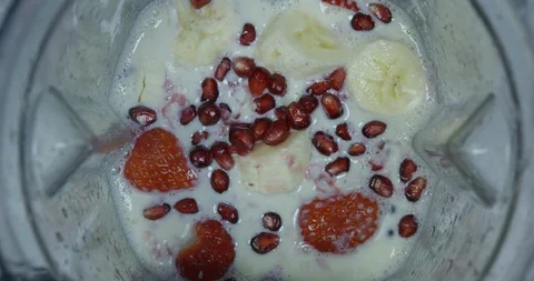 Variety Of Fruit Preparing To Be Made Into A Smoothie Pomegranate Strawberries Stock Footage 114075345