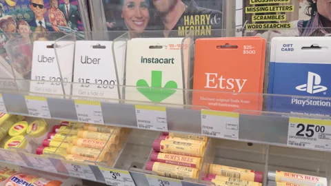 Variety of gift cards at pharmacy store check out 4k Stockbeeldmateriaal 342777078