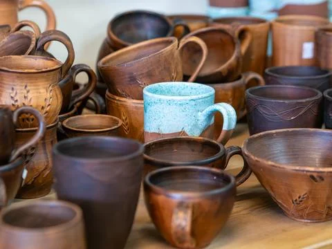 Variety of Handmade Ceramic Tableware and Mugs Stock Photos