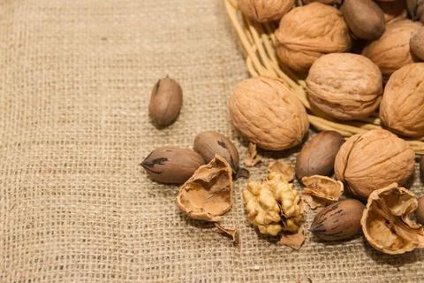 Variety of healthy nuts on rustic background Foto stock