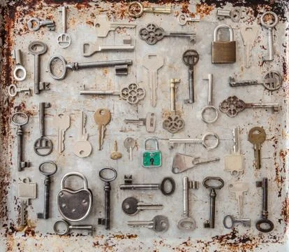 Variety of keys on rusty background Stock Photos