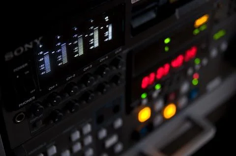 Variety of knobs and switches on a radio broadcasting console Stock Photos