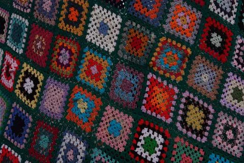 A variety of multi-colored threads arranged in geometric patterns Stock-Fotos