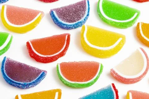 A Variety of Multicolored Candy Fruit Slice Isolated on a White Background Foto stock