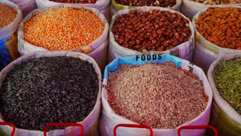 Variety of Nuts and Seeds in Sacks at Market Видео 333226479