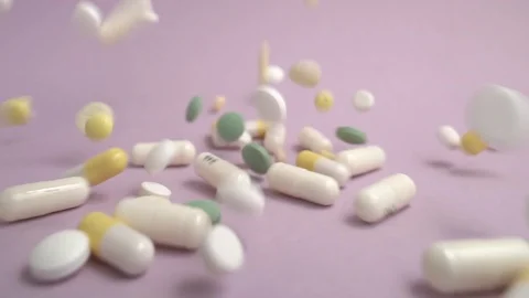 A variety of pills fall in slow motion Stock Footage 103630403