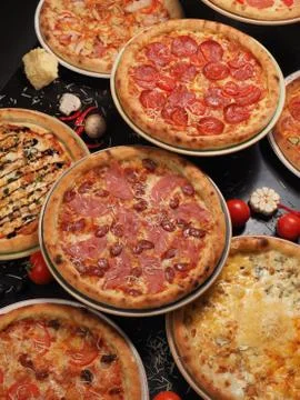 Variety of pizza on the table, top view Stock Photos
