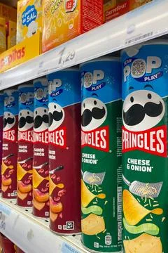 Variety of Pringles stackable potato-based chips in the Carefour supermarket Stock Photos