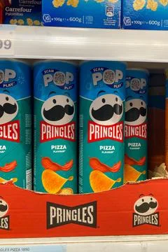 Variety of Pringles stackable potato-based chips in the Carefour supermarket Stock Photos