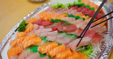Variety of sashimi in a plastic box Stock Footage 234960190