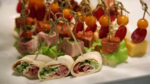 A variety of snacks on white table Stock Footage 70687797