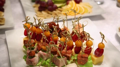 A variety of snacks on white table Stock Footage 70688316