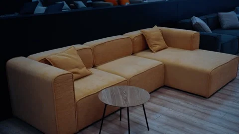 A variety of sofas in many colors. In the center, a yellow-brown sofa with Stock Footage 233379528