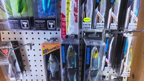 Variety of soft and hard plastic assortment of fishing lures and tackles on.. Stock Footage 311270985