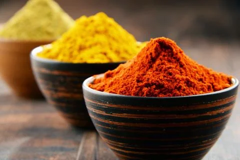 Variety of spices on kitchen table. Stock Photos
