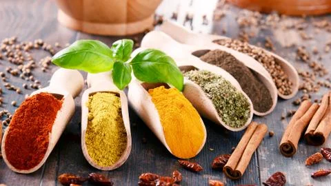 Variety of spices on kitchen table. Foto stock
