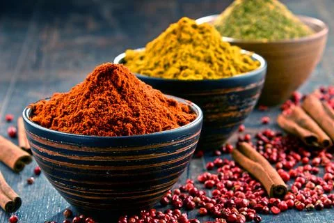 Variety of spices on kitchen table Stock Photos