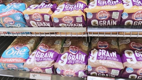Variety of Tip Top branded bread types in plastic packaging Stock Footage 317989933