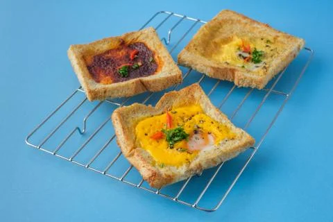 Variety of toast bread with tasty toppings. Healthy food for lunch or breakfa Stock Photos