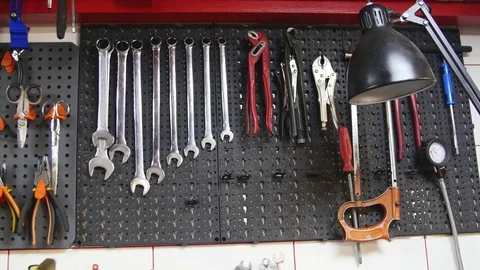 Variety of tools organized on wall 스톡 동영상 75443751