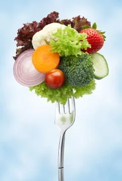 Variety of vegetables on fork Stock Photos