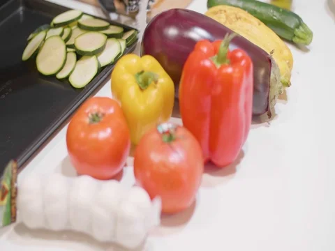 Variety of vegetables on a table in slow motion Video stock 80544225