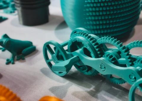 Various 3D printed model objects on a table Stock Photos