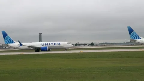 Various Airlines Jet Queues for Takeoff Stock Footage 336816531