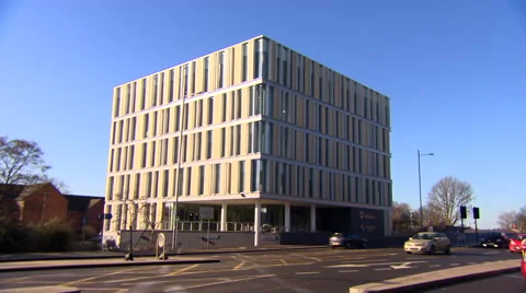 Various Angles of Cube Shaped Building as Cars Drive Past Stock Footage 61484445