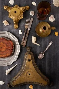 Various antique objects on black chalkboard background Stock Photos