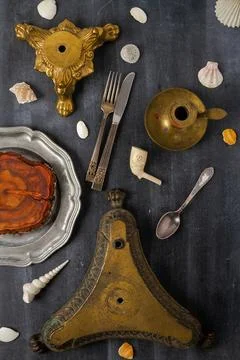 Various antique objects on black chalkboard background Stock Photos