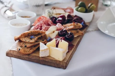 Various appetizer served with vine Stock Photos