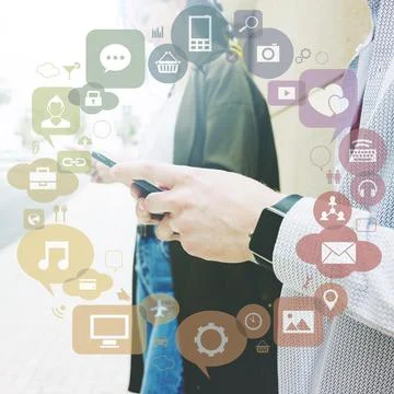 Various applications forming circle front two people using mobile phone Stock Photos