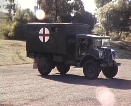 Various Army Trucks (Drive Past Camera) 1980s Stock Footage 59997102