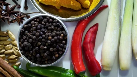 Various aromatic asian spices arranged on clean white background Video stock 333811286