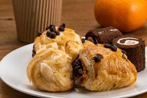 Various baked pastry dessert Eclair filled with corn cream Danish Pastry filled 스톡 사진