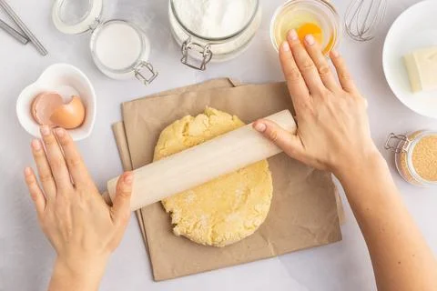 Various baking ingredients - flour, eggs, sugar, butter and kitchen utensils on Stock Photos