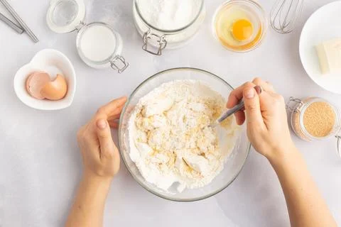 Various baking ingredients - flour, eggs, sugar, butter and kitchen utensils on Stock-Fotos