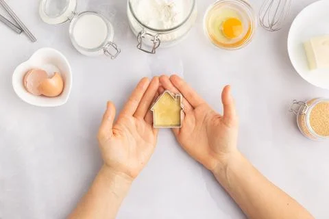 Various baking ingredients - flour, eggs, sugar, butter and kitchen utensils on Stock Photos