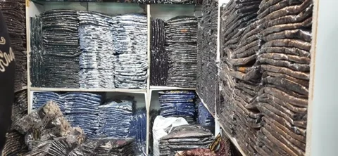 Various Batik shirts for men with Javanese patterned on display ready for sale Stock Footage 311395837
