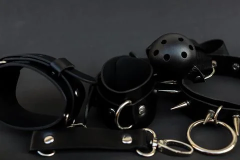 Various black leather items for use in alternative lifestyle activities are Stock Photos