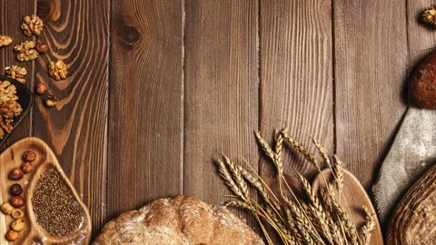Various bread selection flat-lay. Top view of rye, wheat and multigrain rustic Video stock 101437840